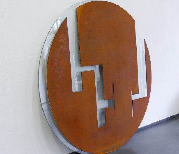 Round iron sculpture with rectangular cutouts 