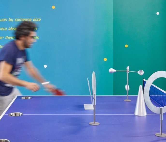 A man is playing table tennis.