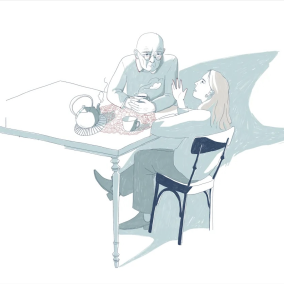 Zwei Personen sprechen am Tisch miteinander