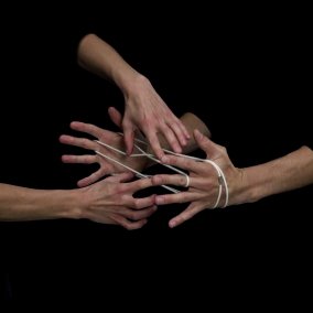 Hands playing string figures, video still © Christoph Oeschger