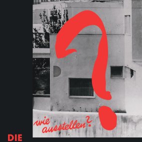 Poster featuring a large red question mark above a black-and-white photograph of a building facade