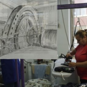 Drawing of a machine and a woman ironning