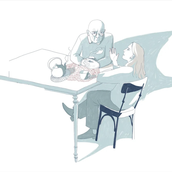 Zwei Personen sprechen am Tisch miteinander