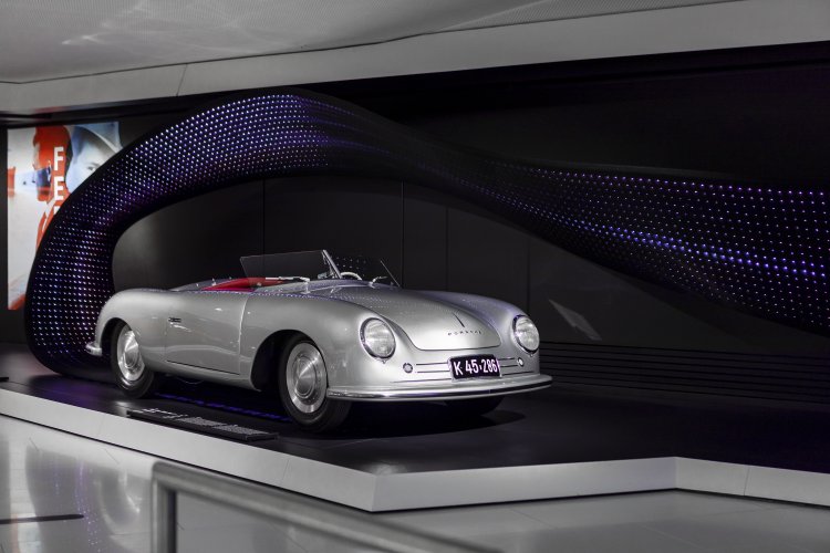 Porsche 356 "No. 1" in front of a band of lights